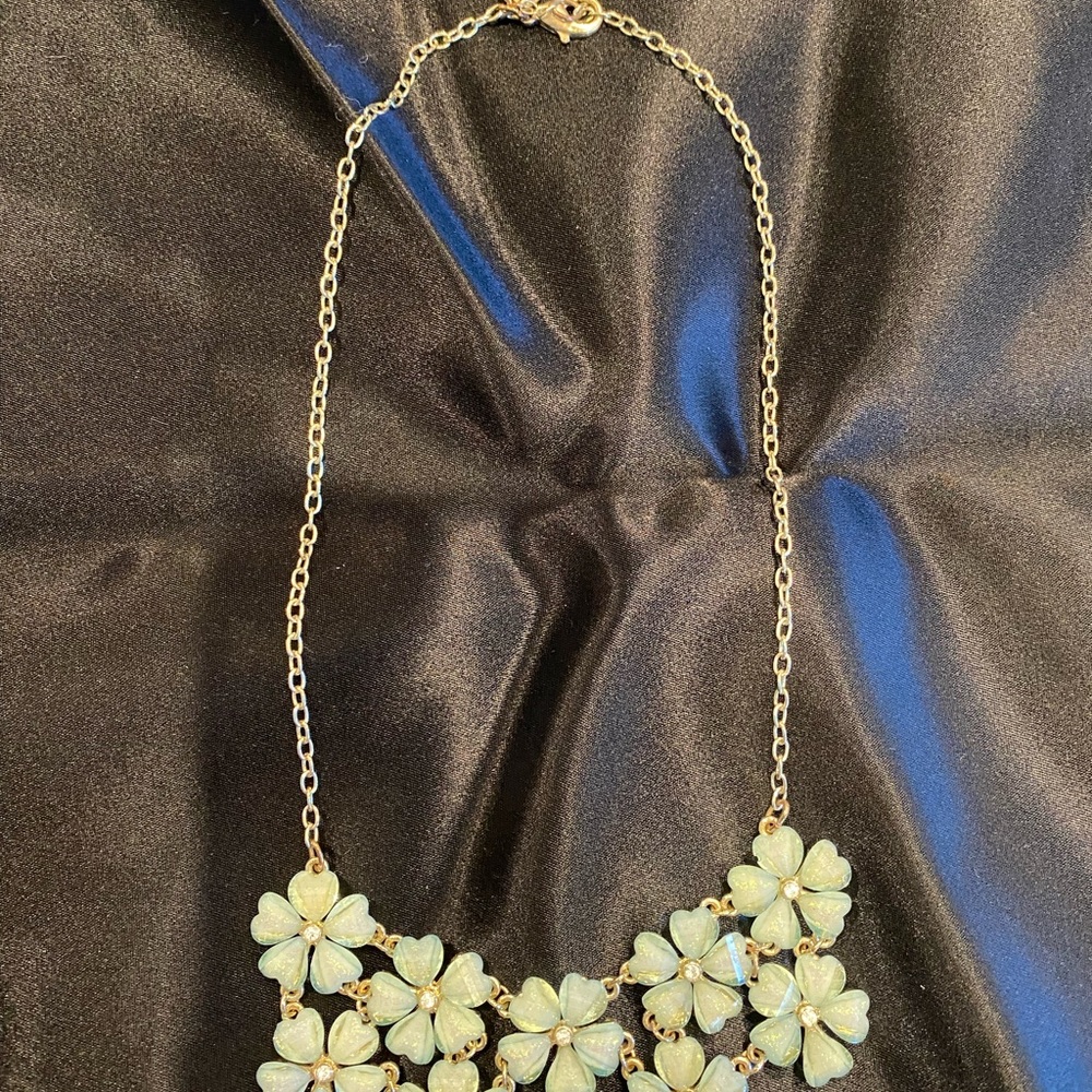 Light blueish-green floral necklace with goldtone chain and matching earrings
